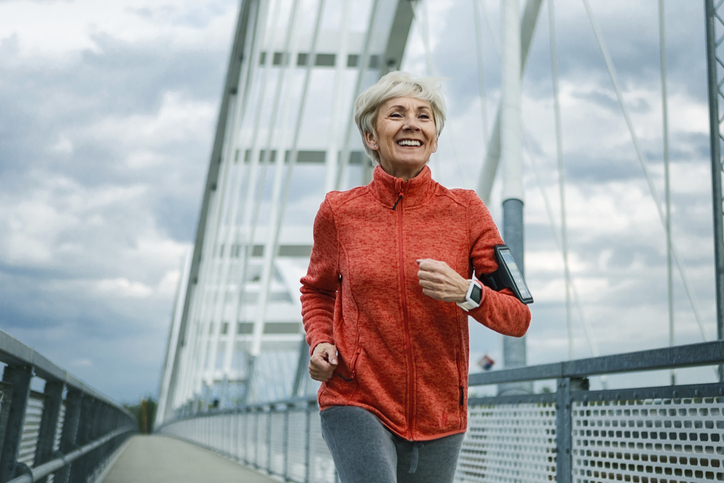 Older woman doing cardio exercise outdoors