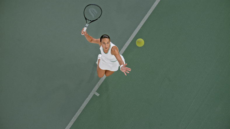 Tennis player playing in tennis court